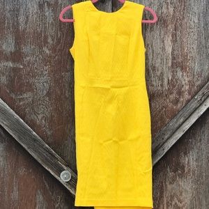 Like new Calvin Klein sheath dress in yellow.